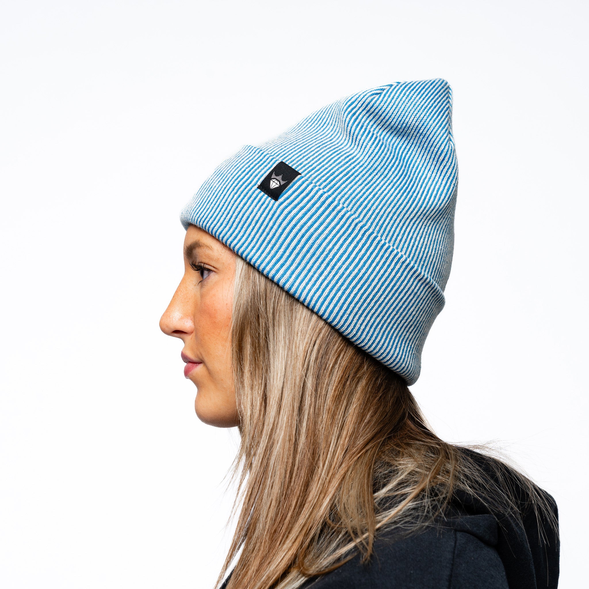 Woman wearing blue Adult Vancouver Goldeneyes Royalty Double Knit Beanie other side angle